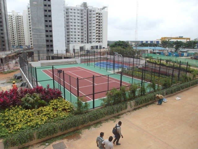Tennis court and landscaped grounds