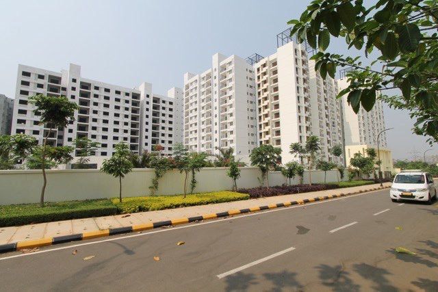 The New Haven towers beside the entrance road