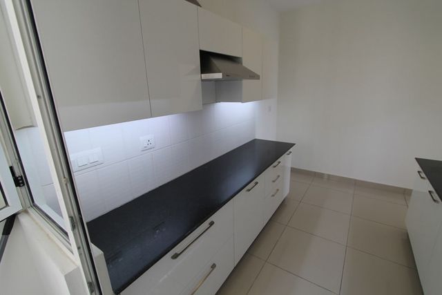 Kitchen with stainless steel chimney